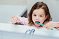 Little girl in pink pyjamas in bathroom brushing teeth by Jozef Polc on 500px