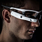 据Woke Design宣布，从2014年9月开始，名为“JET”的第一代消费者运动智能眼镜就已经面世。这一款由Recon Instruments与Afshin Mehin携手开发的智能眼镜集轻质的TR90塑料框与HUD（抬头显示器）于一体，为用户显示关键的数据与信息。投影的位置位于眼镜的右下角处，不但方便用户查看，而且不会阻挡周围的视线。 