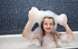 little girl sitting in a bath and imposes soap suds on her head by Radomir Tarasov on 500px