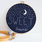 LOVE this "Sweet Dreams" moon and stars hoop art on dark fabric... would make a wonderful addition to baby's room!