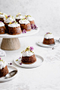 Flourless Lemon Pistachio Cakes with Honey Coconut Whipped Cream is the perfect refreshing spring dessert. These mini cakes boast nutty pistachios, fresh lemon, and are naturally sweetened with honey. #Paleo #grainfree #glutenfree #flourless #dairyfree #c