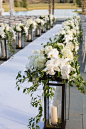 Lantern Aisle Markers with White Flowers | Photography: Perez Photography. Read More:  <a class="text-meta meta-link" rel="nofollow" href="http://www.insideweddings.com/weddings/incredible-tented-ceremony-barn-reception-at-ranc