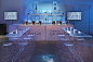 With blue lighting as the main backdrop, the event producers used white or clear furnishings for the cocktail tables, sofas...