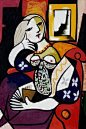 "Woman with Book" by Pablo Picasso.  I love the juxtaposition of shapes and colors.