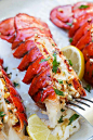 Garlic Butter Lobster Tail poked with a fork.
