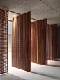 Decorative timber architectural Screens. Functional yet aesthetically pleasing. Would work well as a divider of the indoors from the outdoors, or a decorative feature wall on the inside. the small holes in the screens make for wonderful warm lighting.: