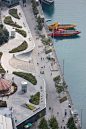 Kiosks with stainless steel canopies and a towering glass and chrome sculpture are among the recent enhancements made to Chicago's Navy Pier, one of the largest public piers in the world: 