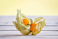 Cape gooseberries on a wooden desk by Kasper Nymann on 500px