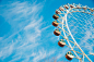 Cloudy Blue Sky over Ferris Wheel