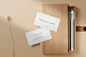 Clean minimal business card mockup on pencil box and plant flower