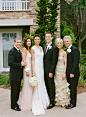 The Couple and Their Parents--Rikki and Adam's fathers wore dark suits fastened with a single orchid boutonniere. The bride's mother wore a pale pink, floor-length dress with thin straps, while the groom's mother donned a strapless, champagne-hued gown wi