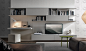 Living room wall unit system combines entertainment needs with and workstation