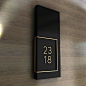   The unit number   in painted acrylic and brushed brass.  