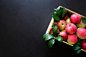 Fresh red apples in the wooden box on black background.  Top view. Copy space stock photo