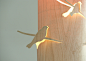 胶合板制作的灯，外面浮出飞翔的鸟儿的造型，生机盎然