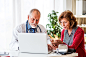 Doctor with laptop talking to a senior woman in office. by Jozef Polc on 500px