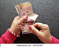 hands of woman counting mexican banknotes  库存照片