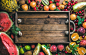 Summer fresh fruit variety with rustic wooden tray in center by Anna Ivanova on 500px