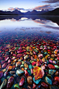 Pebble Shore Lake in Glacier National Park, Montana United States © Jason Savage