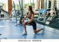 Sport slim fit woman in sportswear exercising building muscles with  Cable Crossover machine in  modern gym. Workout and training concept.