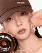 Photo by BBIA ピアー Official Account on March 18, 2024. May be an image of 1 person, makeup, hair, hat and text that says 'OVER GLAZE 05 Caramel glaze'.