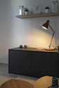 black wooden desk and brown desk lamp