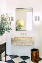 Leigh Herzig&#;39s elegant bathroom with a rustic touch featuring a floating stone sink