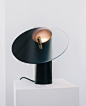 This lamp can be dimmed by rotating its half-tinted glass shade | Yanko Design