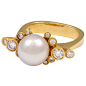 Georg Jensen ring no. 63. 18K gold with 7 mm pearl surrounded by 12 brilliant-cut diamonds.