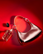 Photo by Armani beauty on December 31, 2023. May be an image of purse, perfume and padlock.