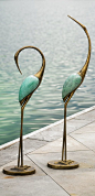 Bring exotic new life to your patio or pool deck with our dramatically sculptural Outdoor Crane Pair.: