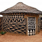 Adboe hut in Tiebele Burkina Faso with traditional tribal painting | Bernardo Ertl: