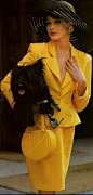 Carla Bruni in a retro '40's yellow ensemble.