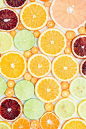I love how the focus on the pattern/colors of the citrus slices makes me look at fruit in a new way. Much more interesting than a photograph of a whole piece...which is what we ALWAYS see when we look at fruit!: 