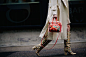 Blogger wearing boots and floral handbag