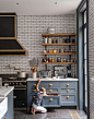 I love the mix of materials and colours in this kitchen. The black rangehood works beautifully with the charcoal grout on the subway tiled splashback.