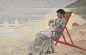 Woman in a deckchair at the water's edge