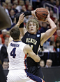 Gonzaga's Kevin Pangos (4) guards Wichita State's Ron Baker (31) in the first half during a third-round game in the NCAA men's college basketball tournament in Salt Lake City Saturday, March 23, 2013. (AP Photo/Rick Bowmer)