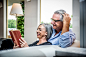 Senior couple spending time in the living room by Cristian Negroni on 500px