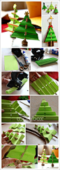 【圣诞快到啦】和大家分享几款圣诞亲子手工：2. 折叠圣诞树，你需要准备绿色卡纸，小木棍（木筷也行）和打孔器。