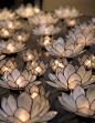 Group a bunch of Lotus tealight candle holders together for a romantic festive moment.: 