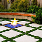 ‘Elfin’ thyme turns this patio into a giant checkerboard. Growing in 4-inch-wide strips dividing poured-in-place concrete squares, it’s irrigated by a subsurface drip system and needs only the occasional light pruning.