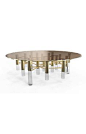 Ike Center Table features a brown glass top with a gold trim, three neat Gold Plated and Glossy Black legs are firmly kept in place by a set of brass tubes in a beautiful composition.