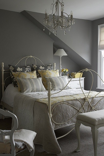 Gray bedroom with ye...