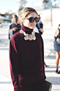 Olivia Palermo at Nina Ricci at Paris Fashion Week.酒红色特别适合秋冬，喜欢这个优雅名媛范儿。为酒红色高领毛衣搭配的镂空花朵装饰增加高贵气质。蛇纹手拿包很美。