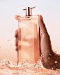Photo by Lancôme Official on April 12, 2024. May be an image of fragrance, perfume, bottle and text.