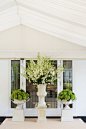 Green hydrangea and white delphinium arrangements