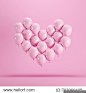 Heart shape made of Pink balloon floating on pink background. Minimal idea concept.