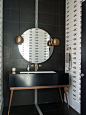 Contemporary black tile black floor powder room idea in Denver with furniture-like cabinets, black walls and an undermount sink