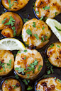 Close up of honey garlic scallops, topped with chopped parsley